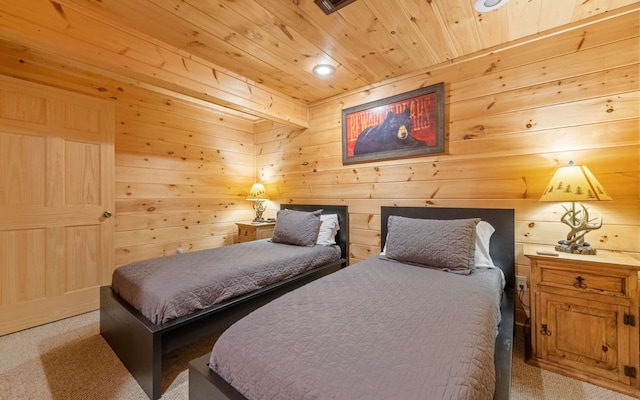 carpeted bedroom featuring wood walls and wood ceiling