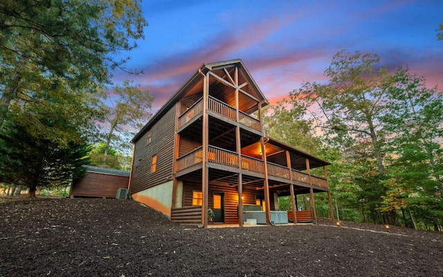 view of back house at dusk