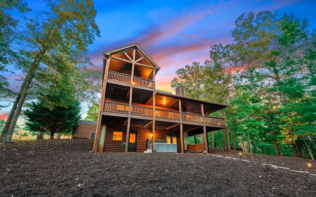 view of back house at dusk