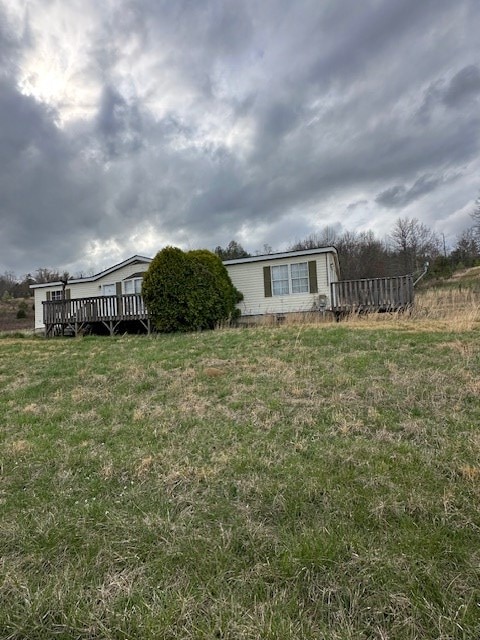 view of yard featuring a wooden deck