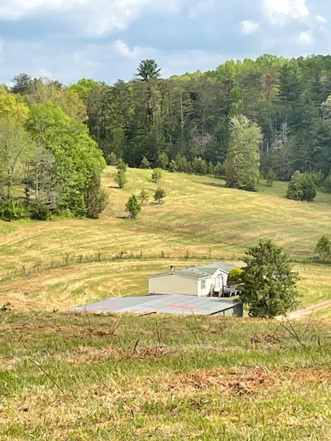 view of storm shelter with a rural view