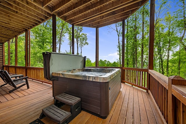 wooden terrace featuring a hot tub
