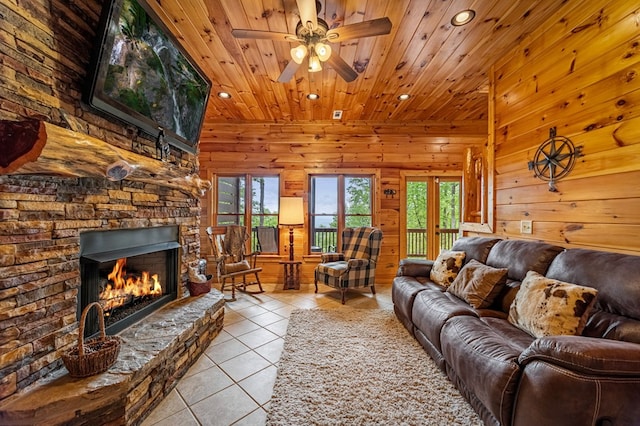 living area with recessed lighting, plenty of natural light, light tile patterned flooring, and wood ceiling