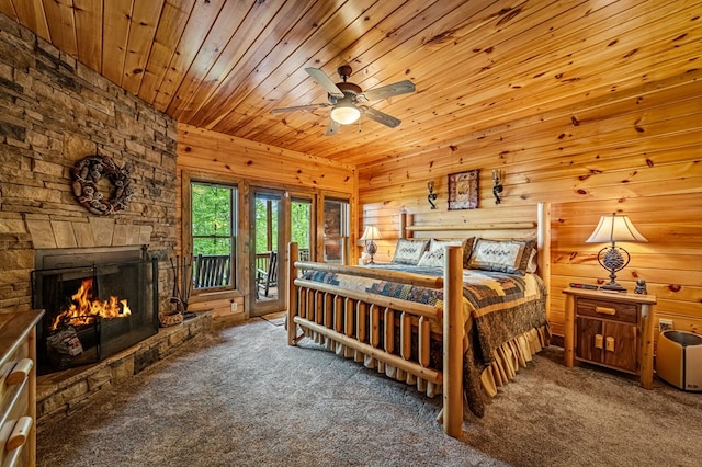 bedroom featuring carpet flooring, a fireplace, wooden ceiling, and access to exterior