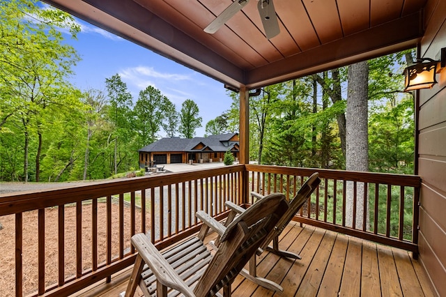 wooden deck featuring ceiling fan