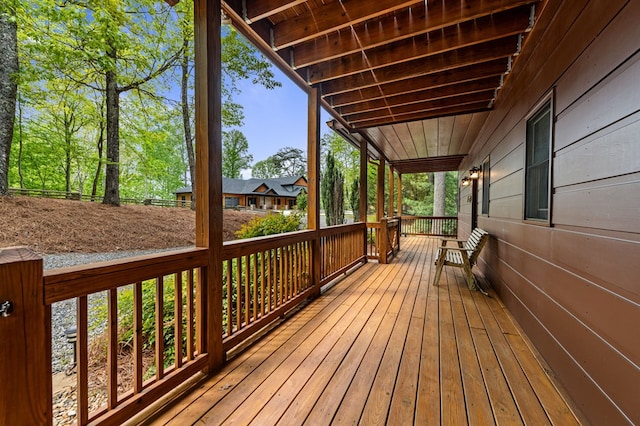 wooden deck featuring covered porch