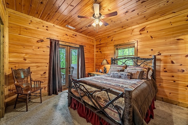 bedroom featuring carpet flooring, access to outside, and multiple windows