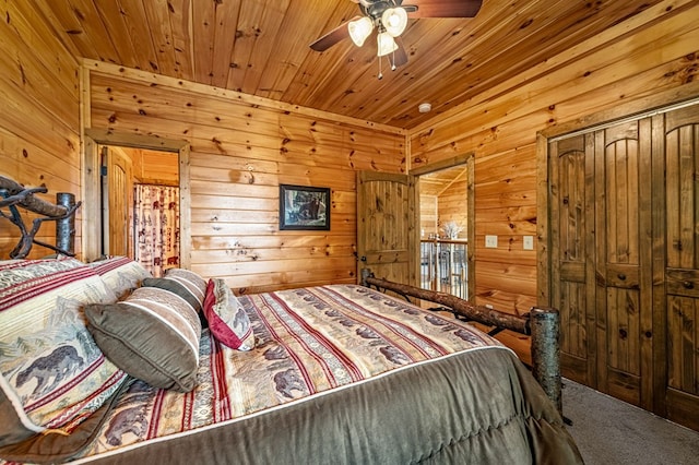 carpeted bedroom featuring wood walls and wood ceiling