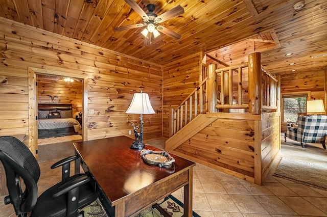 tiled home office with a ceiling fan, wood ceiling, and wooden walls