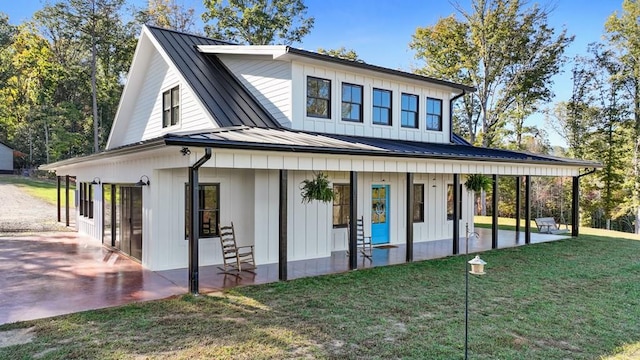 view of front of house with a front lawn and a porch