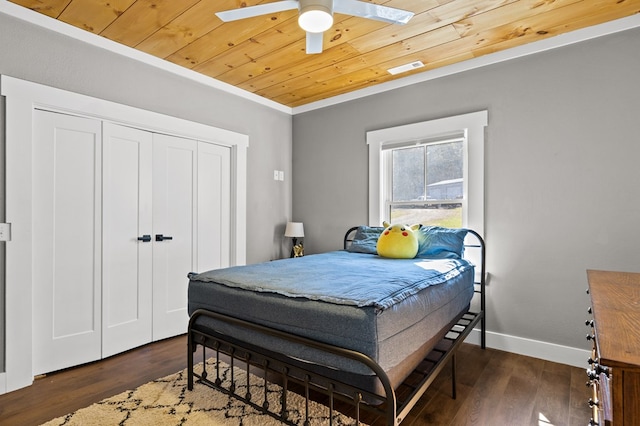 bedroom featuring ceiling fan, crown molding, wood ceiling, and dark hardwood / wood-style floors