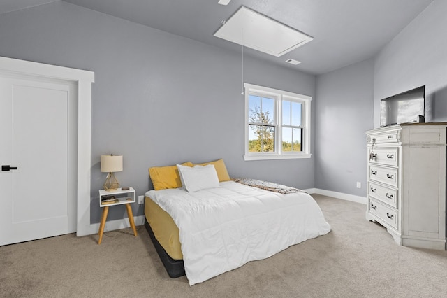 bedroom featuring light colored carpet