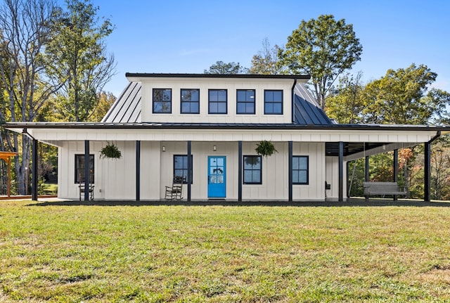 back of property featuring a lawn and a porch