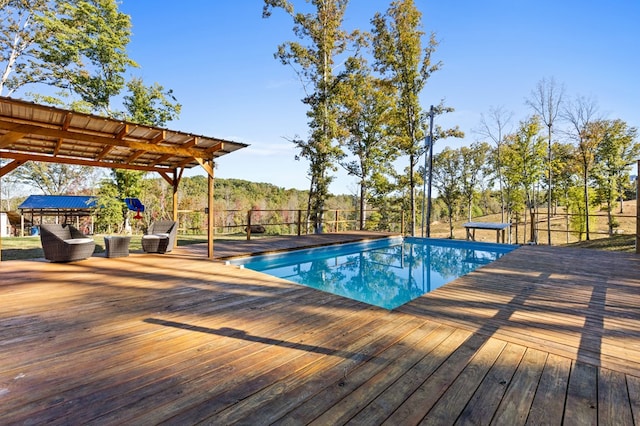 view of pool with a wooden deck