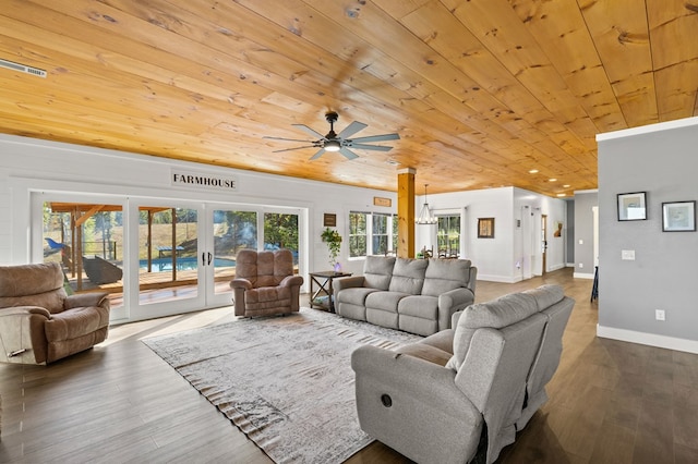 living room with ceiling fan with notable chandelier, french doors, wood-type flooring, and wood ceiling