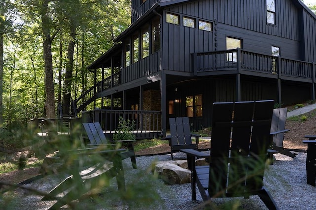 365 Browns Cove Rd, Blue Ridge, GA 30513 - back of property with board and batten siding, stairway, and a deck