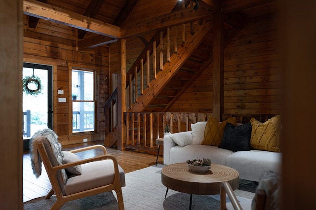 365 Browns Cove Rd, Blue Ridge, GA 30513 - living room featuring wood walls, wood-type flooring, stairway, wood ceiling with exposed beams, and high vaulted ceiling