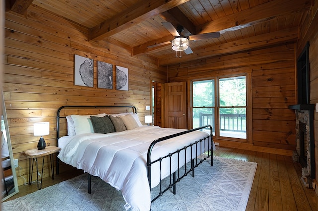 365 Browns Cove Rd, Blue Ridge, GA 30513 - bedroom with wood ceiling with exposed beams, wood walls, wood-type flooring, and ceiling fan
