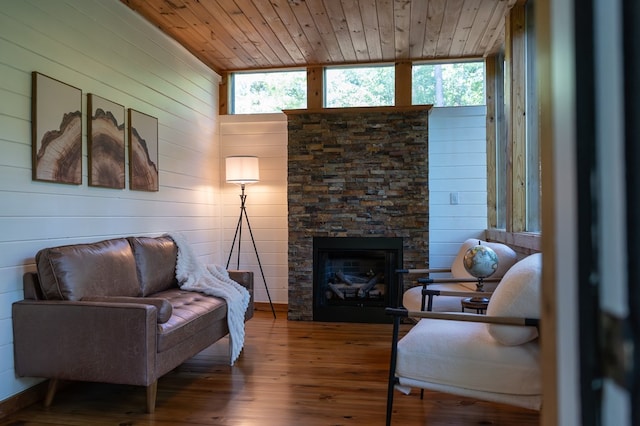 365 Browns Cove Rd, Blue Ridge, GA 30513 - living room featuring wood-type flooring, a fireplace, plenty of natural light, wooden ceiling, and wooden walls
