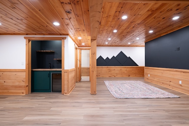 365 Browns Cove Rd, Blue Ridge, GA 30513 - additional living space featuring beverage cooler, recessed lighting, wainscoting, bar with sink, and wood finished floors
