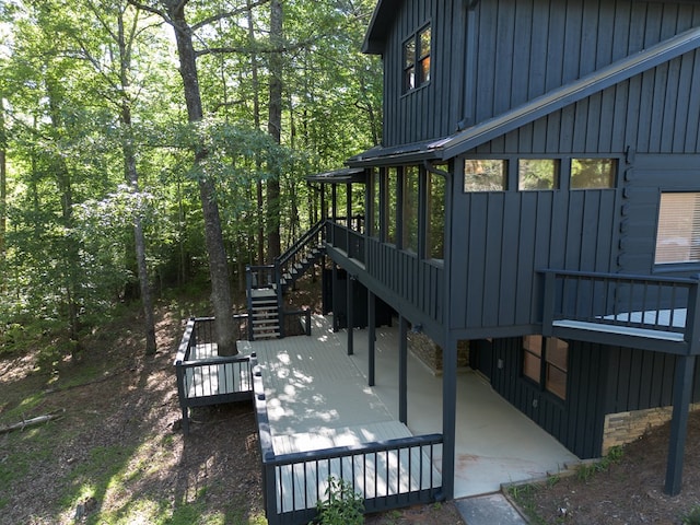 365 Browns Cove Rd, Blue Ridge, GA 30513 - view of home's exterior featuring board and batten siding, stairs, a wooden deck, and a patio area