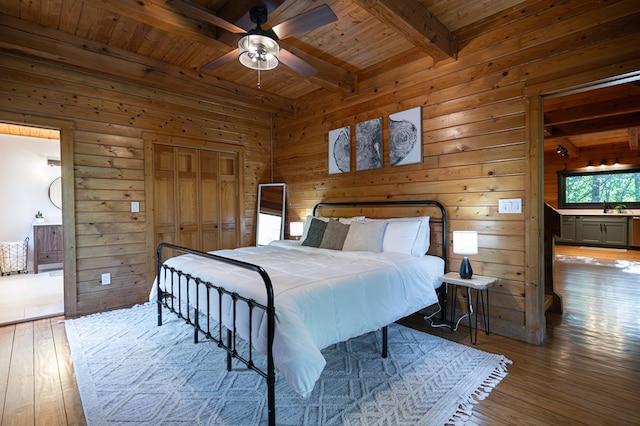 365 Browns Cove Rd, Blue Ridge, GA 30513 - bedroom with wood ceiling with exposed beams, hardwood / wood-style floors, wood walls, and a sink