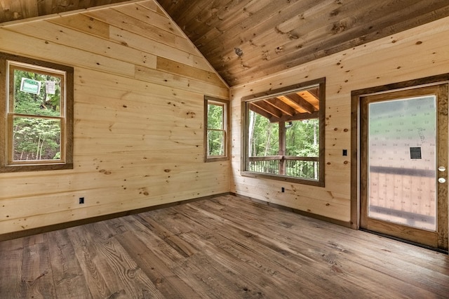 bonus room with vaulted ceiling, wood ceiling, wood finished floors, and wood walls