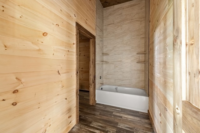 bathroom featuring wooden walls and wood finished floors