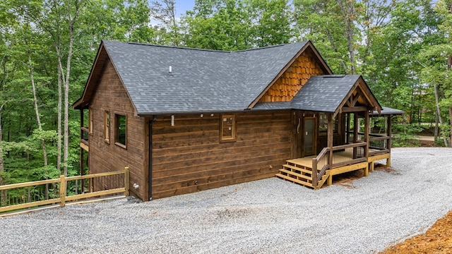 view of front of house featuring roof with shingles