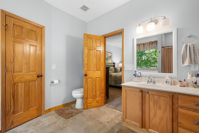 904 Villa Dr, Ellijay, GA 30540 - full bathroom featuring vanity, stone finish floors, and ensuite bathroom