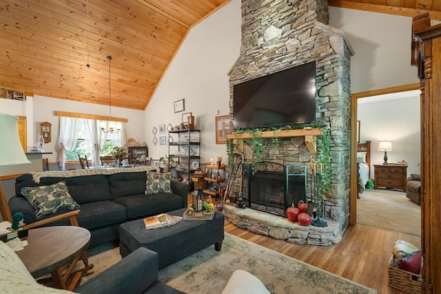 904 Villa Dr, Ellijay, GA 30540 - living area featuring wood ceiling, a chandelier, a stone fireplace, wood finished floors, and high vaulted ceiling