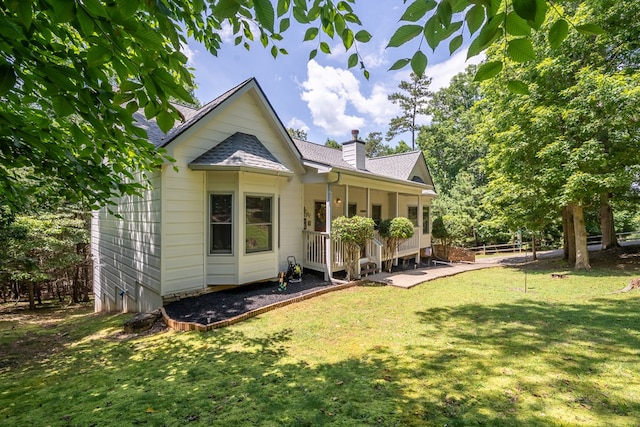 904 Villa Dr, Ellijay, GA 30540 - back of house featuring a chimney, a yard, a porch, and roof with shingles