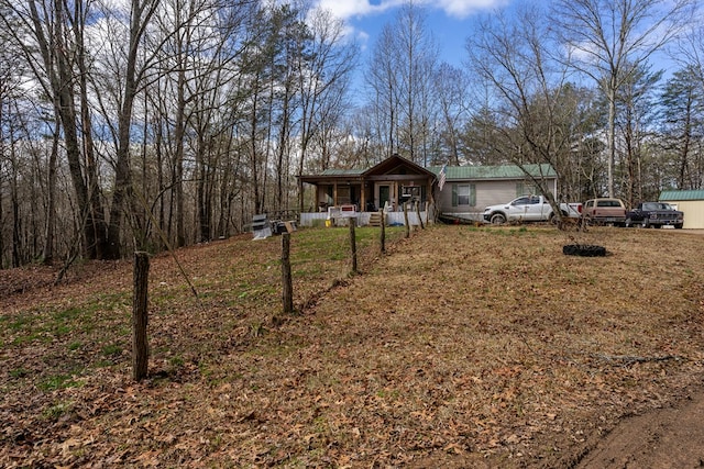 view of front of property with a porch and a front yard