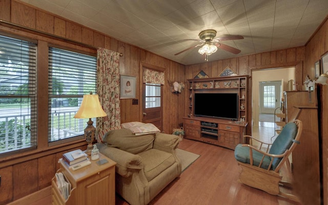 living room with plenty of natural light and light hardwood / wood-style flooring