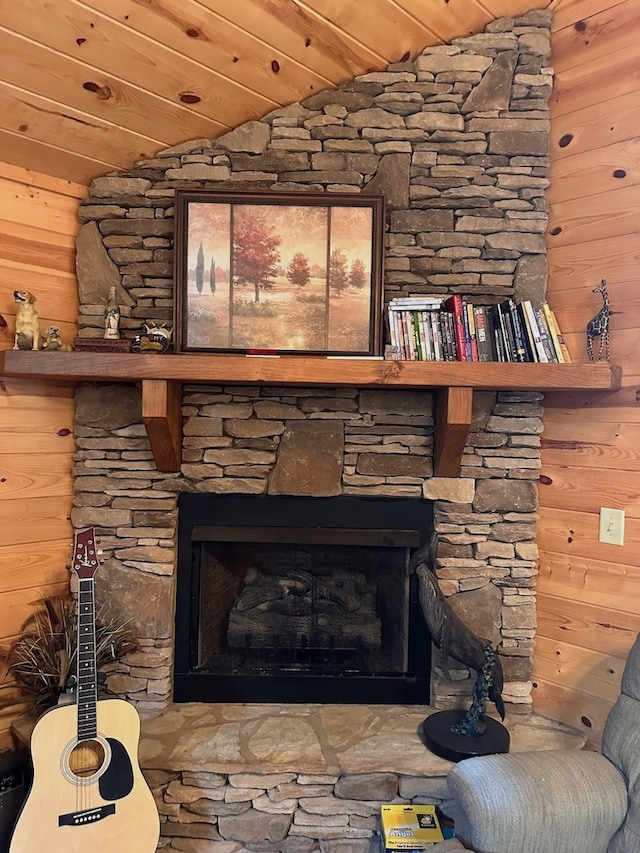 details featuring a fireplace and wooden walls