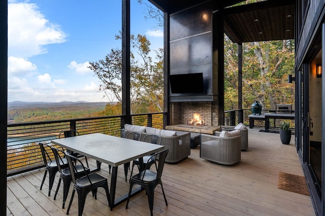 wooden deck featuring an outdoor living space and outdoor dining area