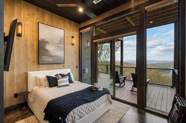 bedroom featuring wooden ceiling, wooden walls, and access to outside
