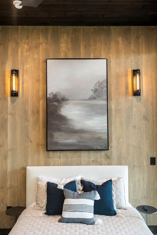 bedroom with wooden ceiling and wooden walls