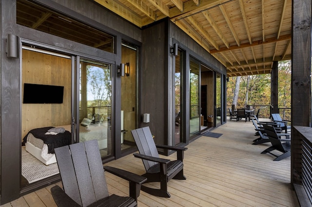 wooden terrace featuring outdoor dining space