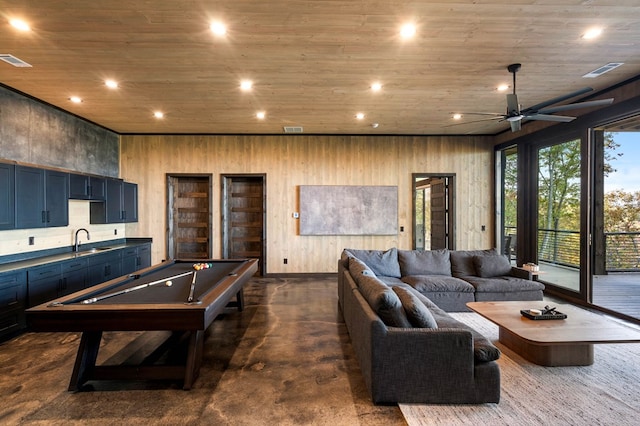 playroom with recessed lighting, visible vents, finished concrete flooring, and a sink