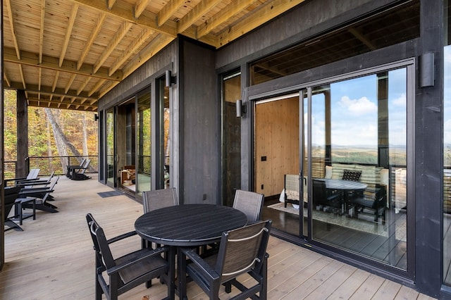 wooden deck with outdoor dining area