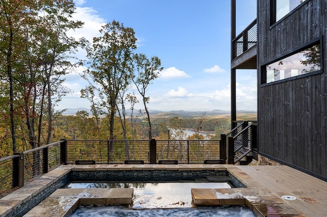 wooden deck featuring a mountain view