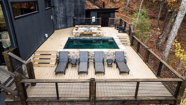 view of swimming pool featuring a deck and a fenced in pool