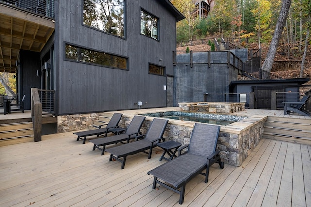 wooden deck featuring an outdoor pool and an outdoor hot tub