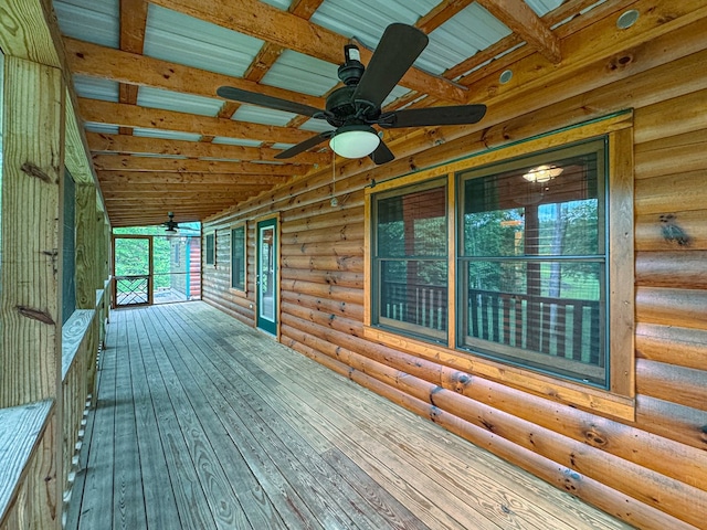 wooden deck with a ceiling fan
