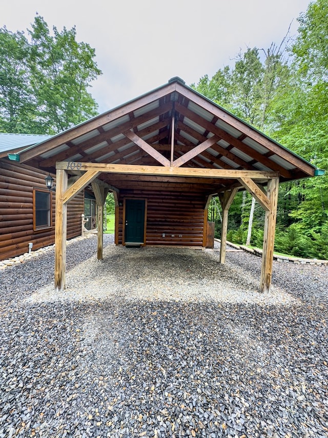 view of parking with a carport and driveway