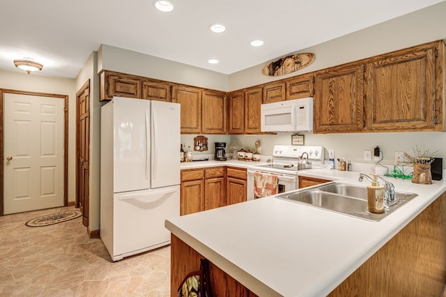 177 Lake Dr, Topton, NC 28781 - kitchen with white appliances, a sink, a peninsula, light countertops, and recessed lighting
