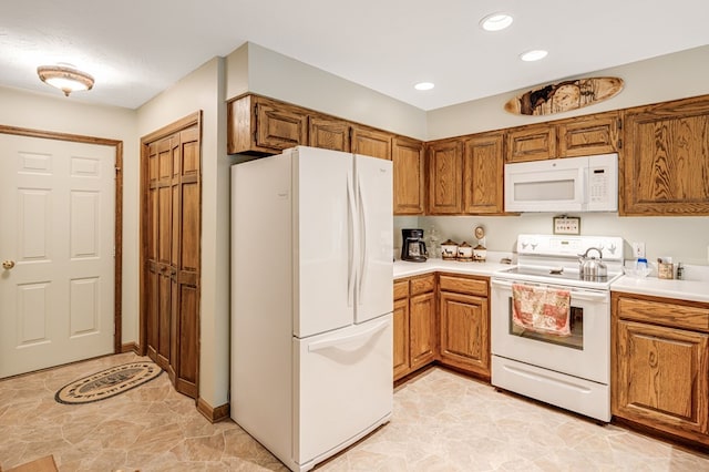 177 Lake Dr, Topton, NC 28781 - kitchen with white appliances, brown cabinets, light countertops, and recessed lighting