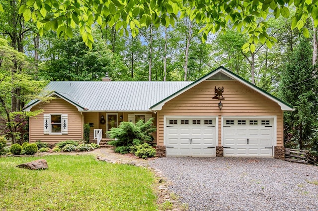 177 Lake Dr, Topton, NC 28781 - single story home with gravel driveway, a garage, metal roof, a chimney, and a front yard