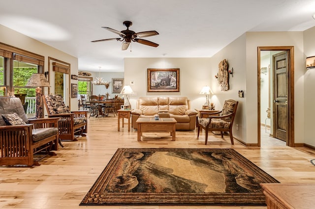 177 Lake Dr, Topton, NC 28781 - living area featuring light wood-type flooring, ceiling fan, and a chandelier